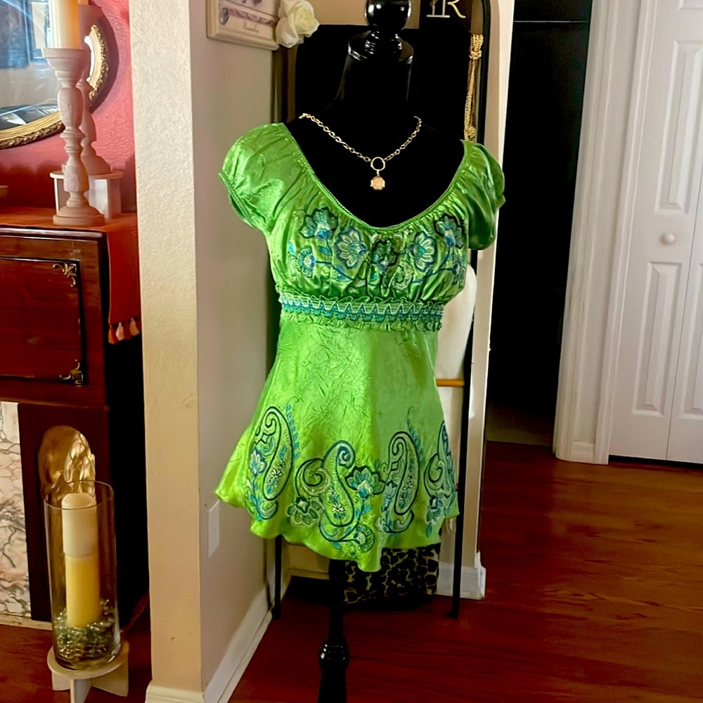 Satin chartreuse green with embroider blue design. Ties in the back